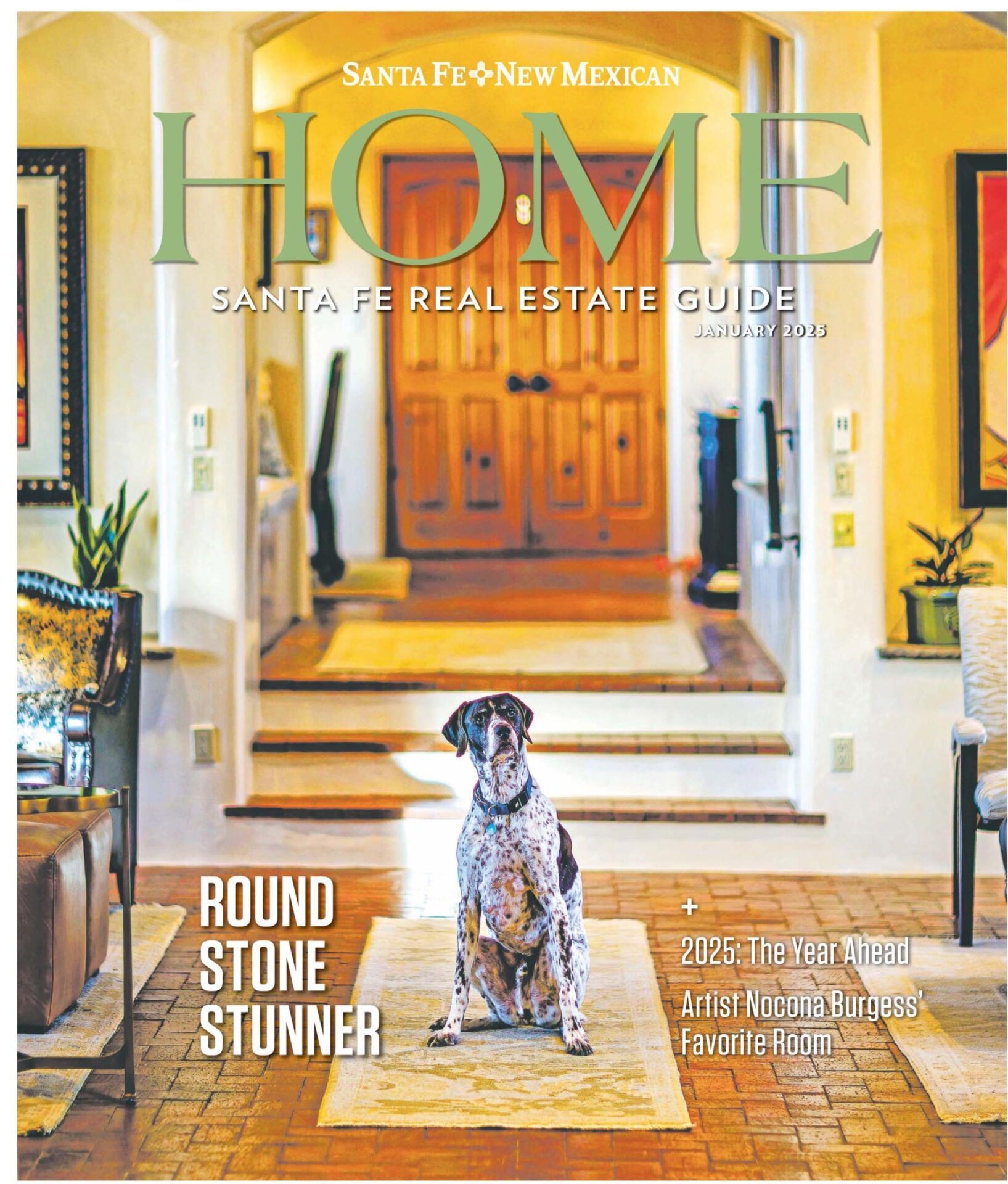 Santa Fe-style home with adobe architecture, wooden doors, brick floors, and Southwestern decor. A spotted dog sits on a rug in the warm, inviting space.