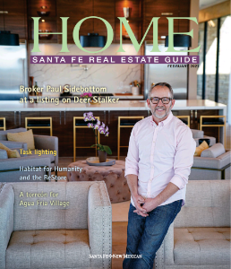 Broker Paul Sidebottom in a modern Santa Fe home, featured in the Santa Fe Real Estate Guide, showcasing architectural design and real estate expertise.